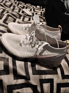 Nike Women's White Flyknit Athletic Shoes with Pale Pink Swoosh